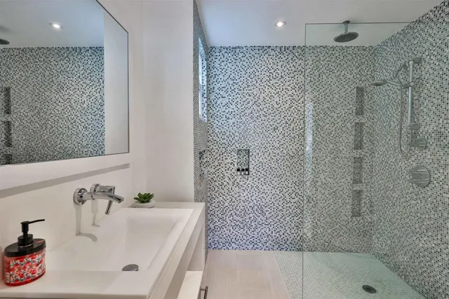 a bathroom with a bathtub and shower