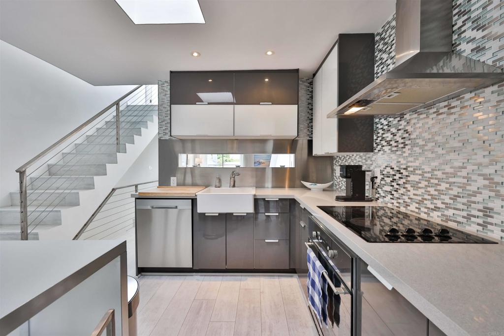 942 D Avenue, Unit B Coronado, CA 92118 - Photo 26 of 38 a kitchen with stainless steel appliances a sink stove and cabinets