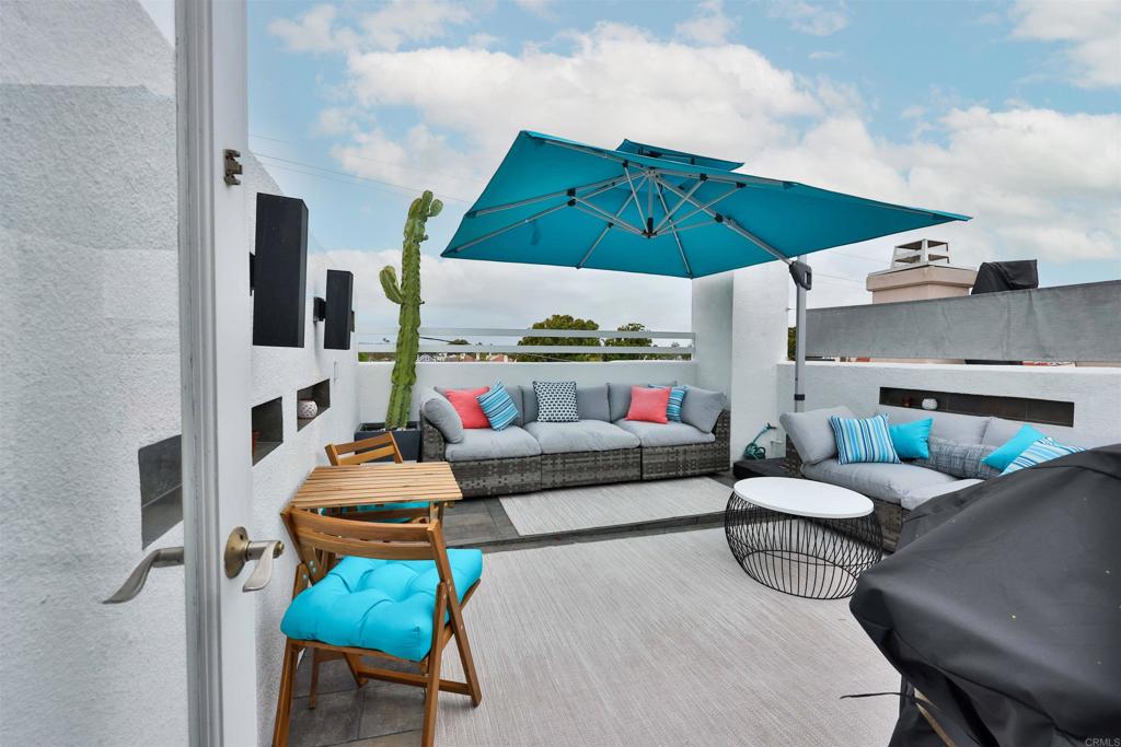 942 D Avenue, Unit B Coronado, CA 92118 - Photo 31 of 38 a living room with furniture and a fireplace