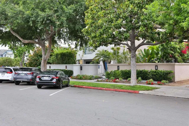 a view of street with parked cars