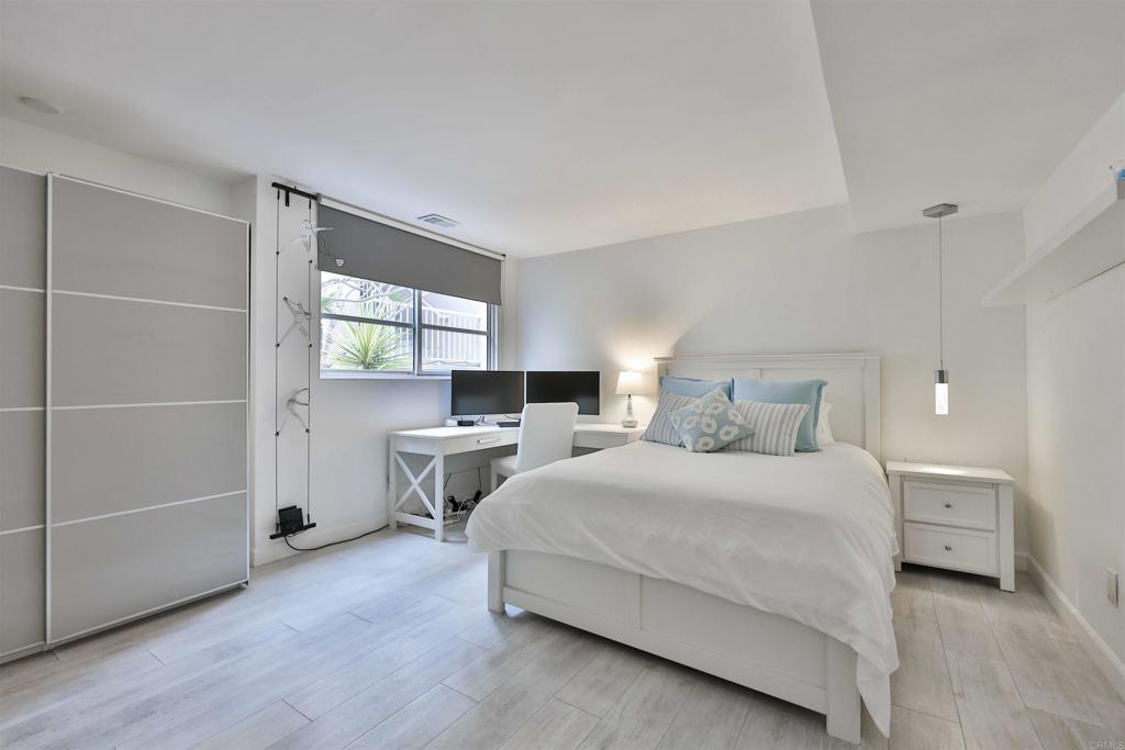 942 D Avenue, Unit B Coronado, CA 92118 - Photo 6 of 38 a bedroom with a bed and a window