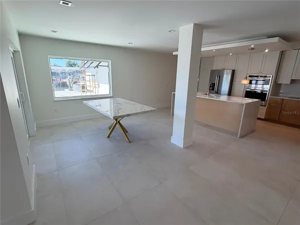 a view of a kitchen with furniture and a window