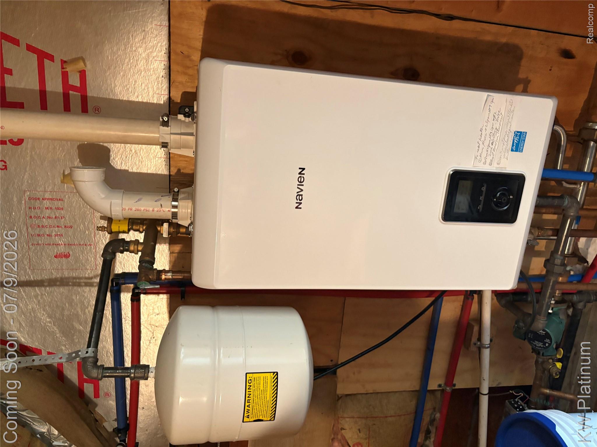 7280 North Road Fort Gratiot, MI 48059 - Photo 2 of 40 Utility room Upstairs attic Energy Star Tankless hot water heater and hot water heat.