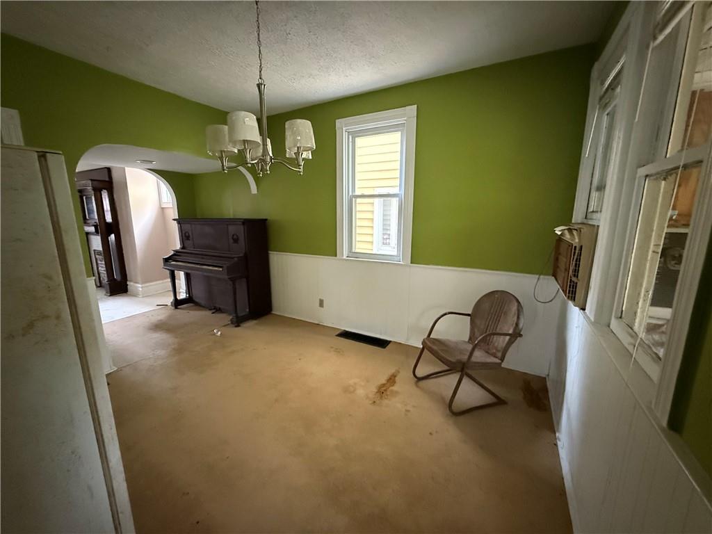 136 Queen Street Kittanning, PA 16201 - Photo 12 of 29 a living room with furniture and a chandelier