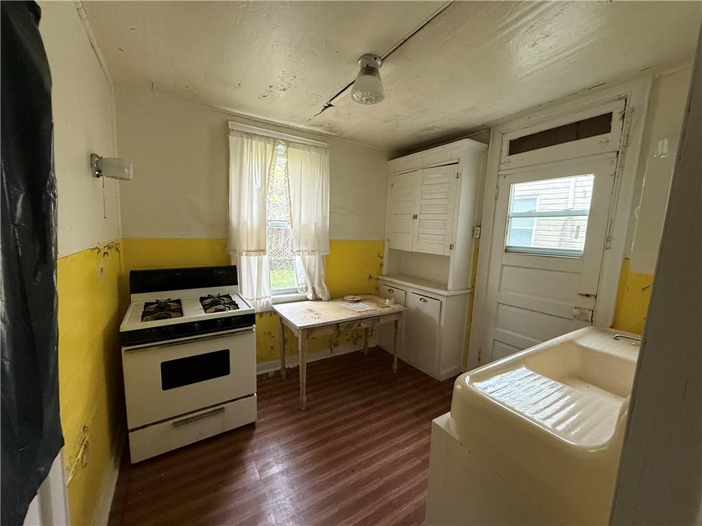136 Queen Street Kittanning, PA 16201 - Photo 13 of 29 a kitchen with a stove and a wooden floor