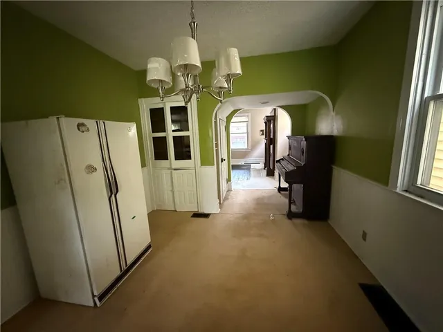 a view of a hallway with wooden shelves
