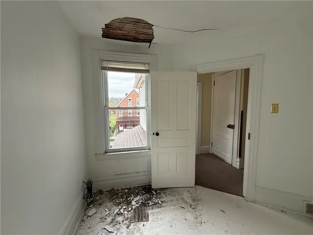 a view of entryway with wooden floor