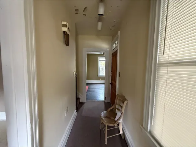 a view of a livingroom with furniture and windows