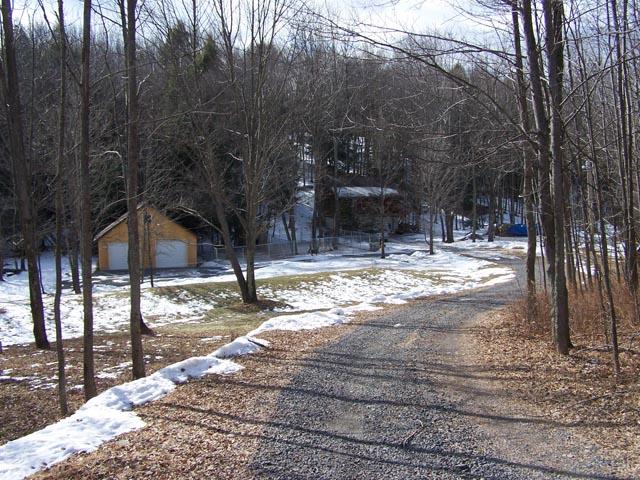 69 T 457 Corbin Road Hop Bottom, PA 18824 - Photo 5 of 12 a view of a yard with trees