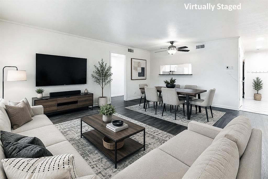 4561 North O'Connor Road, Unit 1292 Irving, TX 75062 - Photo 1 of 10 Open-concept living area featuring dark wood-finish flooring, white walls, and recessed lighting