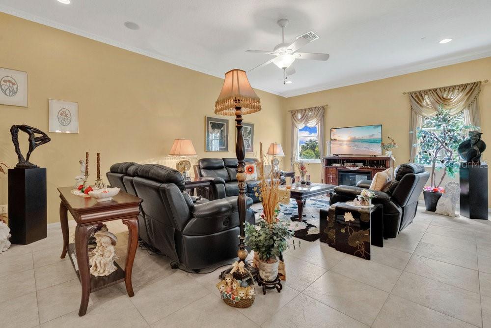 6139 Andreozzi Lane Windermere, FL 34786 - Photo 15 of 53 a living room with furniture chess board and a chandelier
