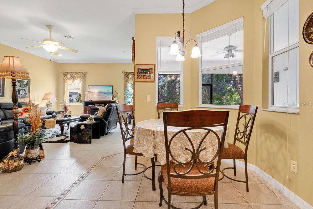 6139 Andreozzi Lane Windermere, FL 34786 - Photo 18 of 53 a view of a dining room with furniture a chandelier and a large window