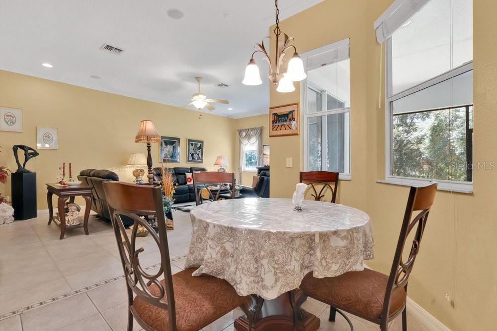 6139 Andreozzi Lane Windermere, FL 34786 - Photo 19 of 53 a view of a dining room with furniture and a chandelier