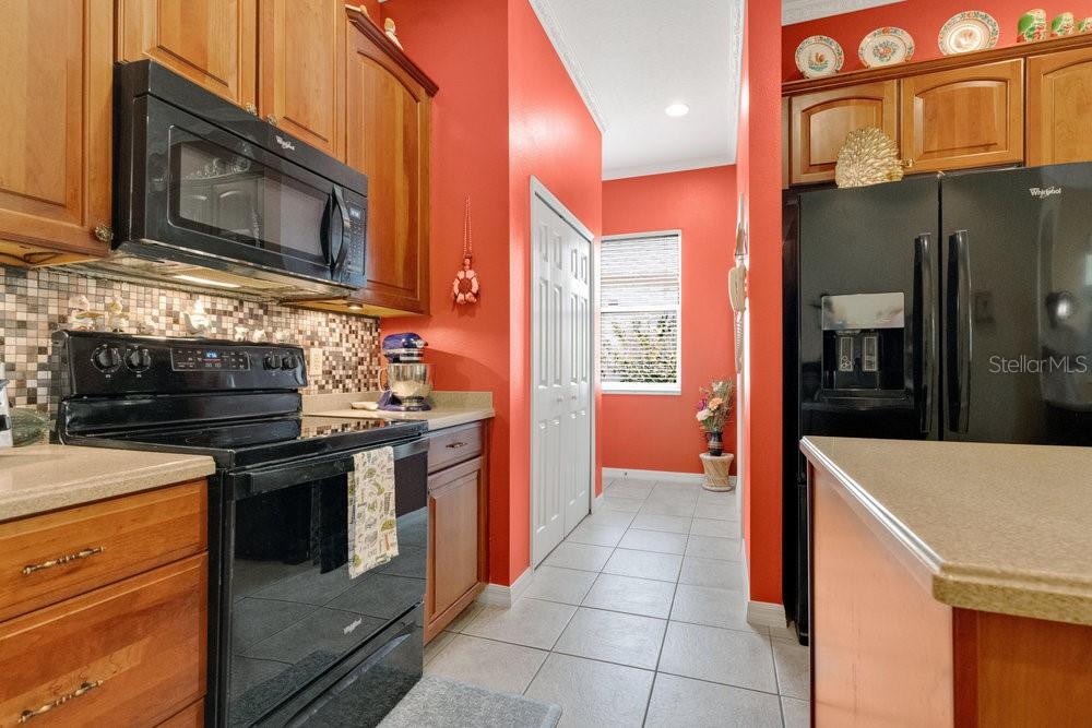6139 Andreozzi Lane Windermere, FL 34786 - Photo 22 of 53 a kitchen with stainless steel appliances granite countertop a stove and a refrigerator