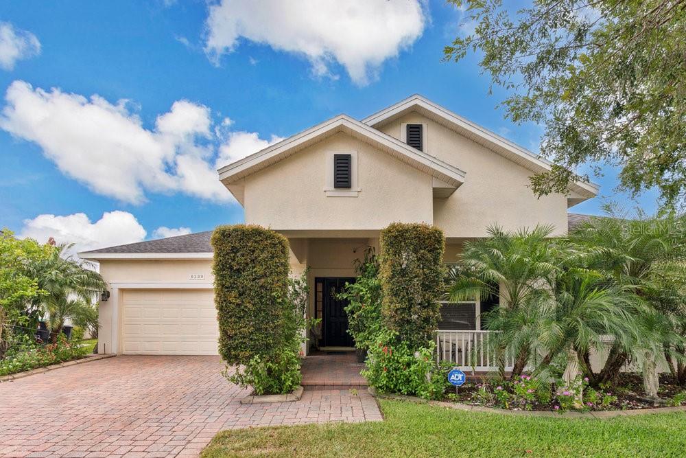 6139 Andreozzi Lane Windermere, FL 34786 - Photo 3 of 53 a front view of a house with garden
