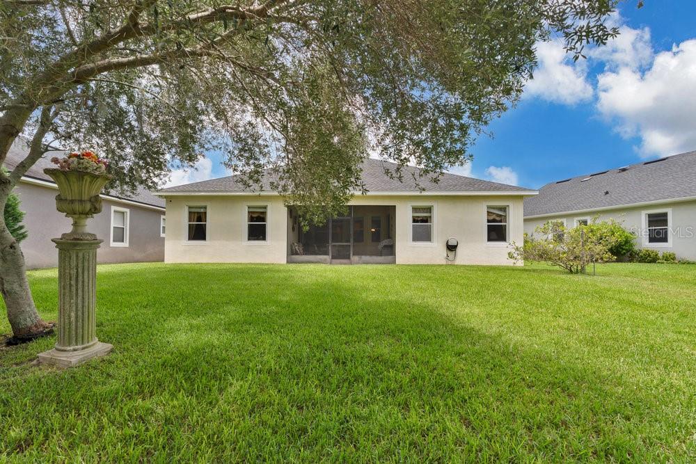 6139 Andreozzi Lane Windermere, FL 34786 - Photo 40 of 53 a view of a house with a backyard