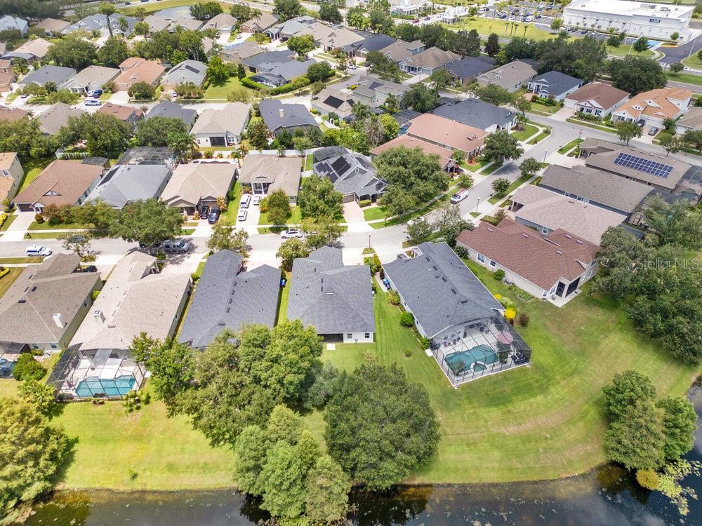 6139 Andreozzi Lane Windermere, FL 34786 - Photo 48 of 53 an aerial view of residential houses with swimming pool and lake view