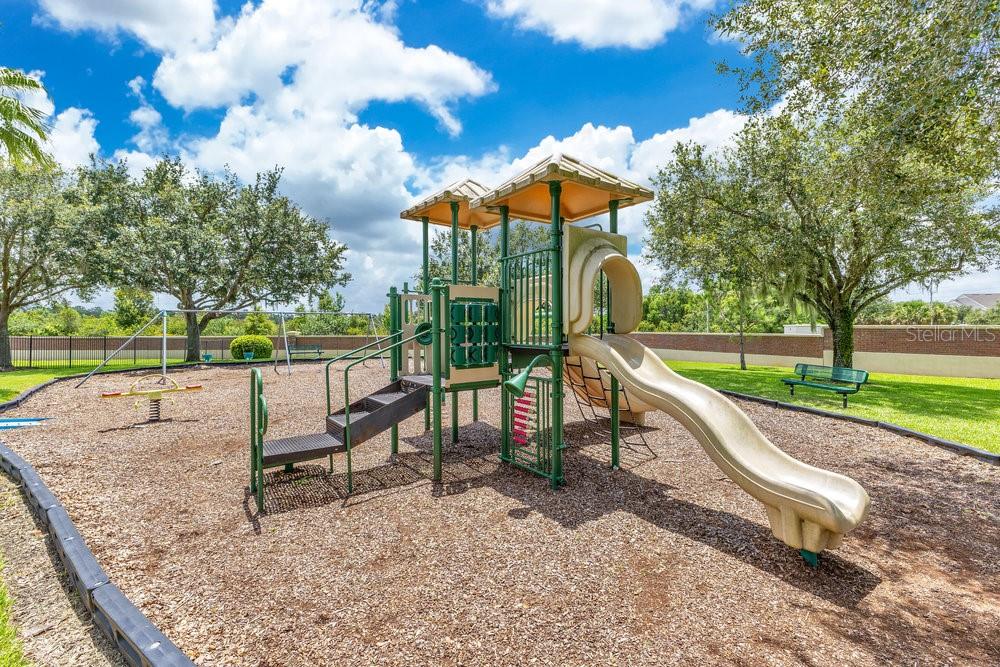 6139 Andreozzi Lane Windermere, FL 34786 - Photo 52 of 53 a park view with a bench