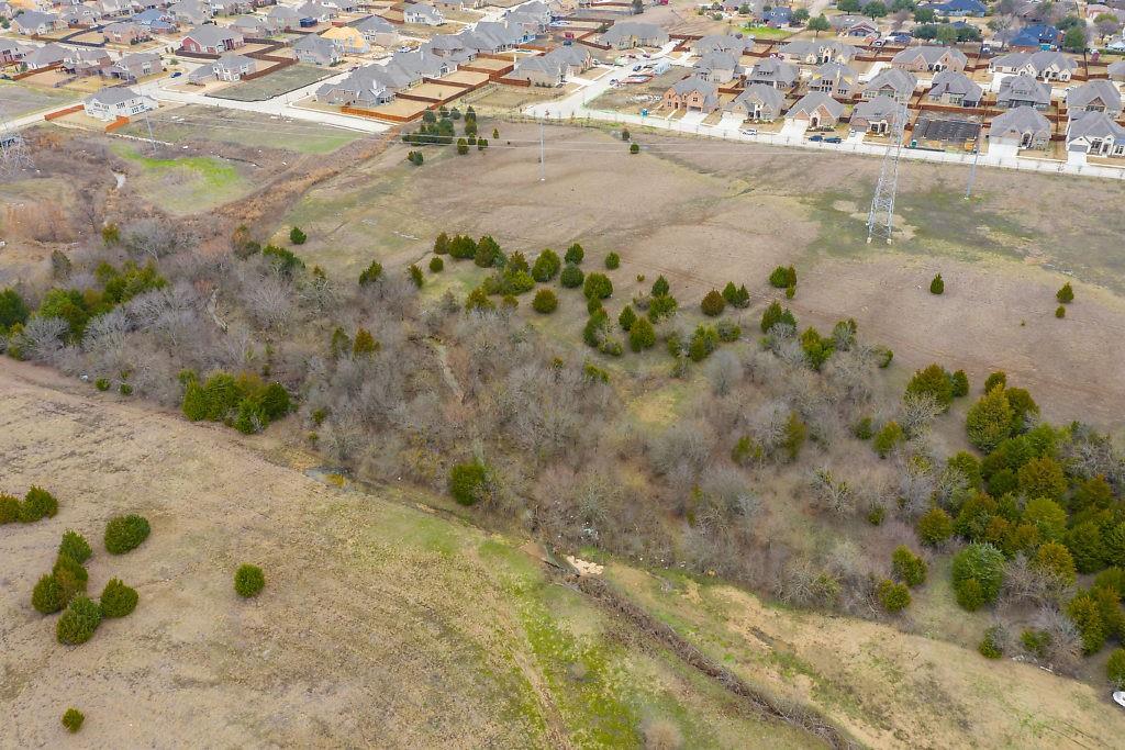 4505 Merritt Road Sachse, TX 75048 - Photo 12 of 22 a view of a dry yard with wooden fence
