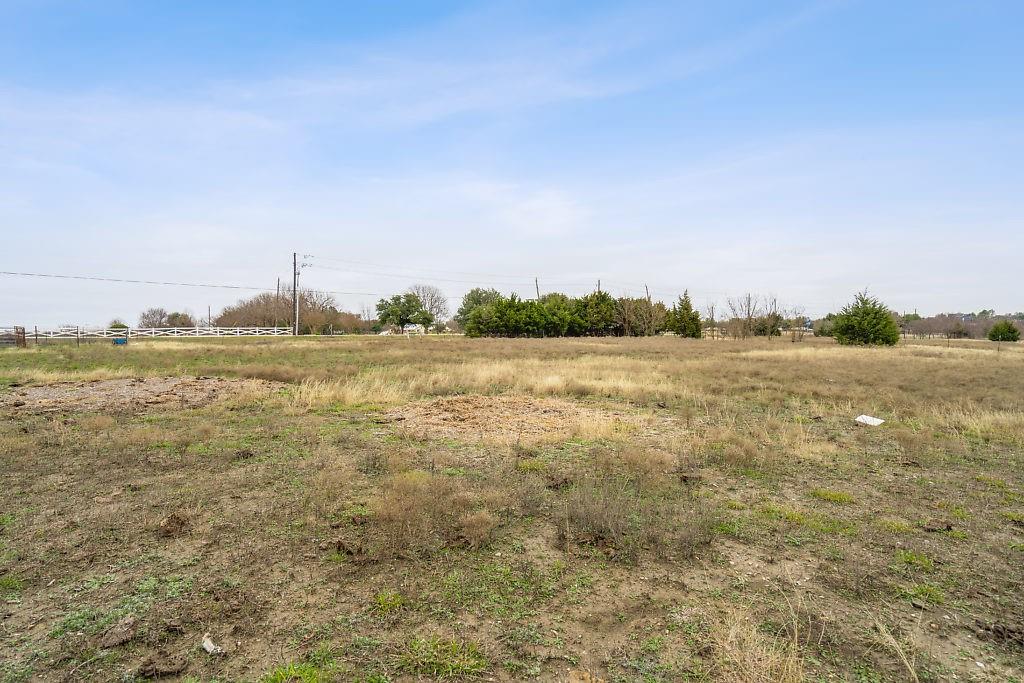 4505 Merritt Road Sachse, TX 75048 - Photo 22 of 22 a view of a lake with houses in the background