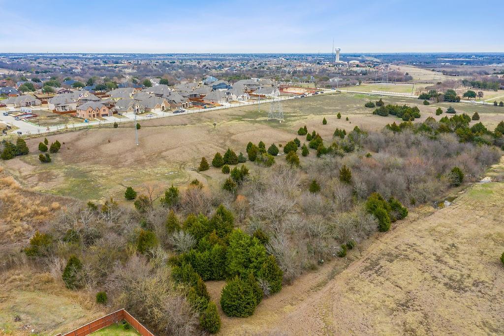 4505 Merritt Road Sachse, TX 75048 - Photo 8 of 22 an aerial view of residential houses with outdoor space