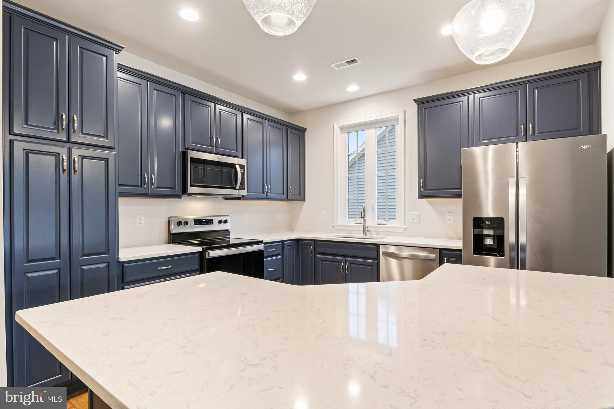 113 Garrison Drive Morganton, NC 28655 - Photo 6 of 63 a kitchen with granite countertop a refrigerator stove top oven and sink
