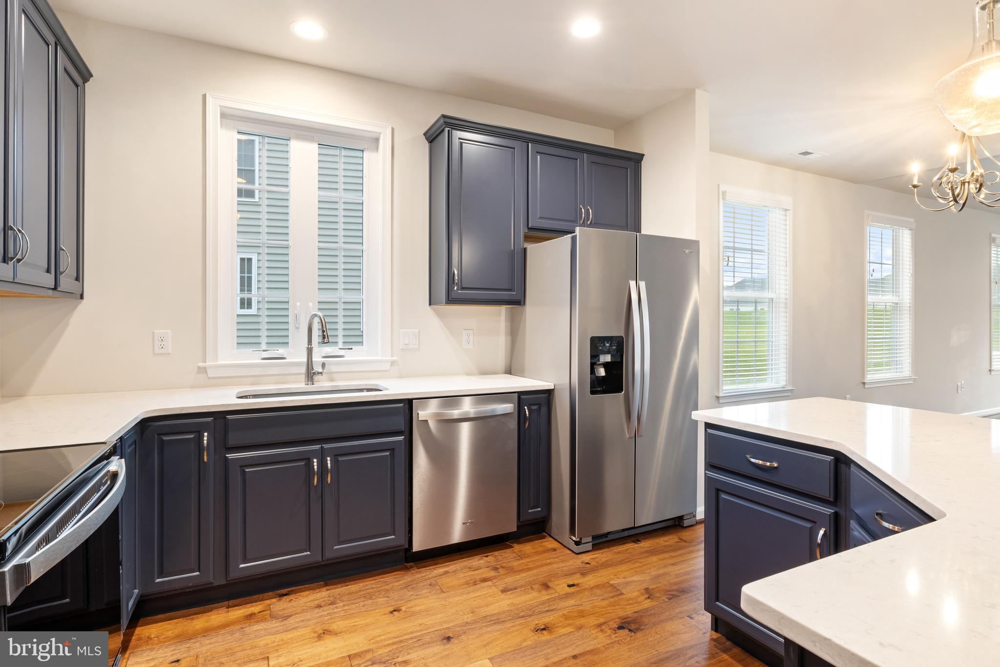 113 Garrison Drive Morganton, NC 28655 - Photo 9 of 63 a kitchen with stainless steel appliances granite countertop a refrigerator and a sink