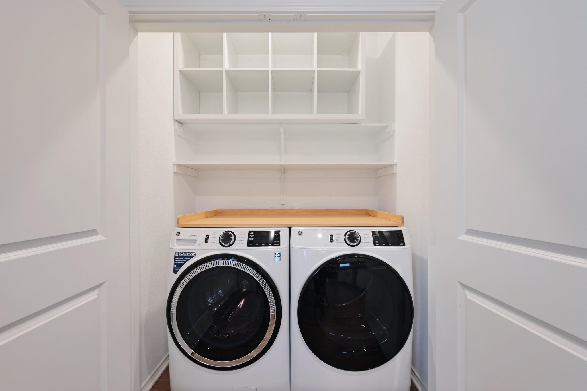 167 Rioja, Unit MAIN HOUSE) Kyle, TX 78640 - Photo 15 of 26 Washroom featuring washing machine, clothes dryer and built-in shelving