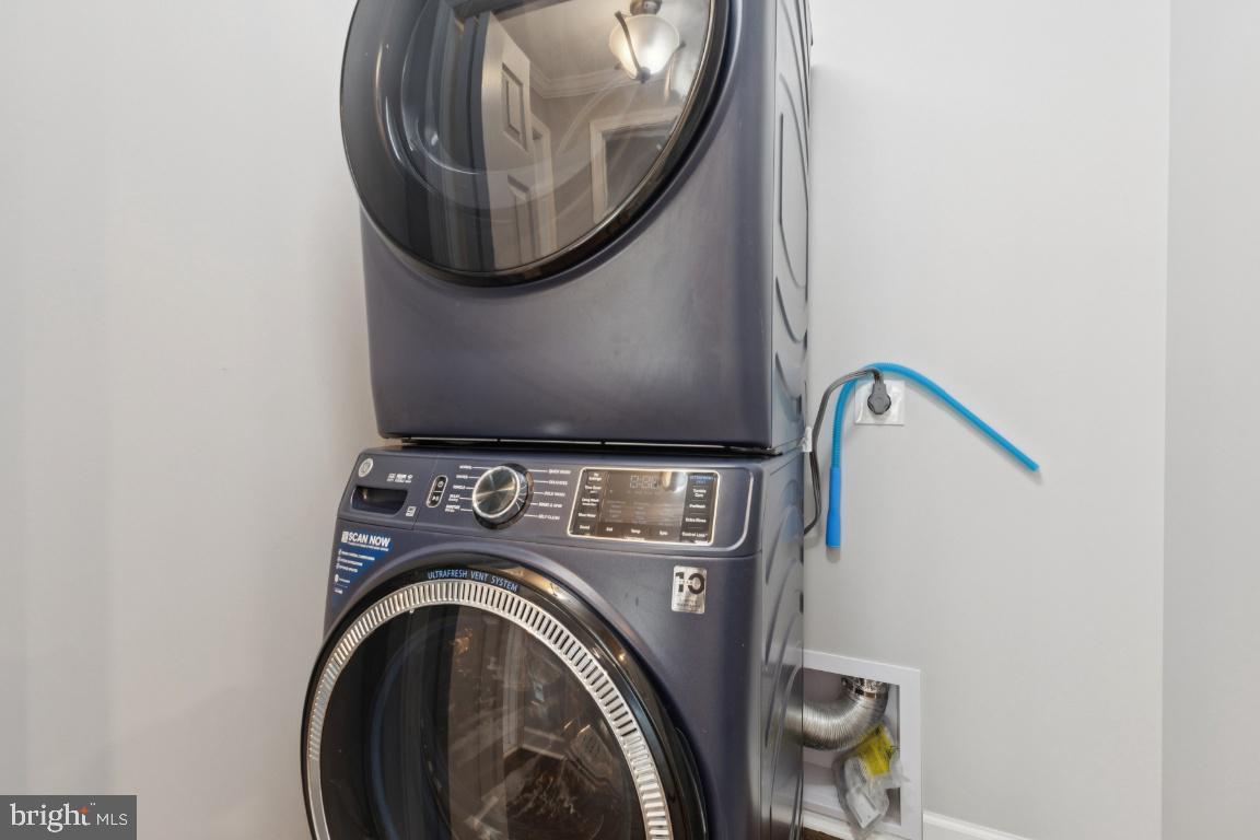 8368 Brock Bridge Road Laurel, MD 20724 - Photo 13 of 37 a utility room with dryer and washer