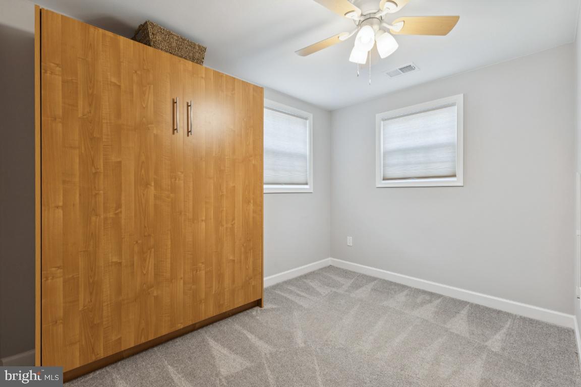 8368 Brock Bridge Road Laurel, MD 20724 - Photo 17 of 37 a view of an empty room with chandelier fan