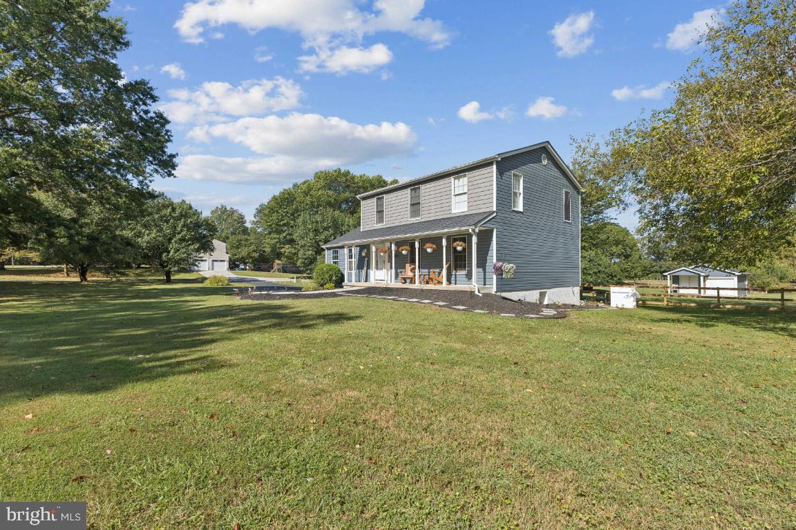 8368 Brock Bridge Road Laurel, MD 20724 - Photo 2 of 37 a front view of a house with a garden