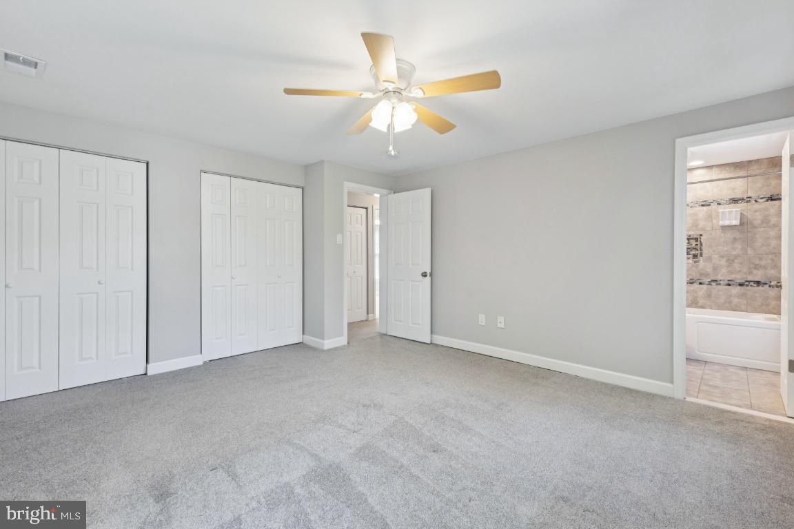 8368 Brock Bridge Road Laurel, MD 20724 - Photo 23 of 37 an empty room with fan and windows