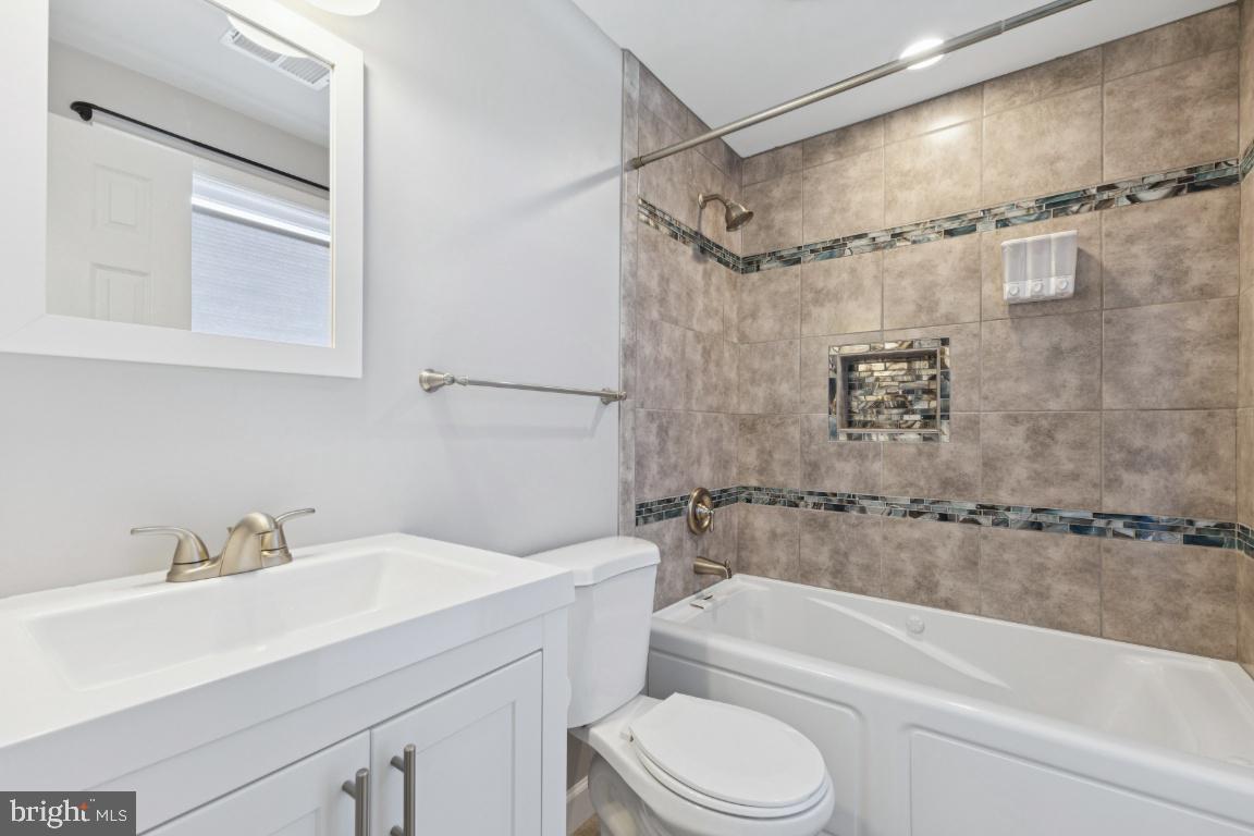 8368 Brock Bridge Road Laurel, MD 20724 - Photo 24 of 37 a bathroom with a sink toilet and shower