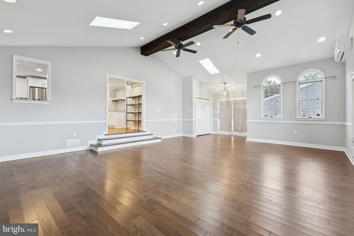 8368 Brock Bridge Road Laurel, MD 20724 - Photo 9 of 37 an empty room with wooden floor and windows