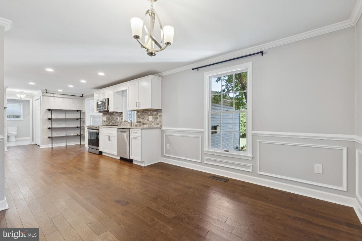 8368 Brock Bridge Road Laurel, MD 20724 - Photo 10 of 37 a view of kitchen with wooden floor and window