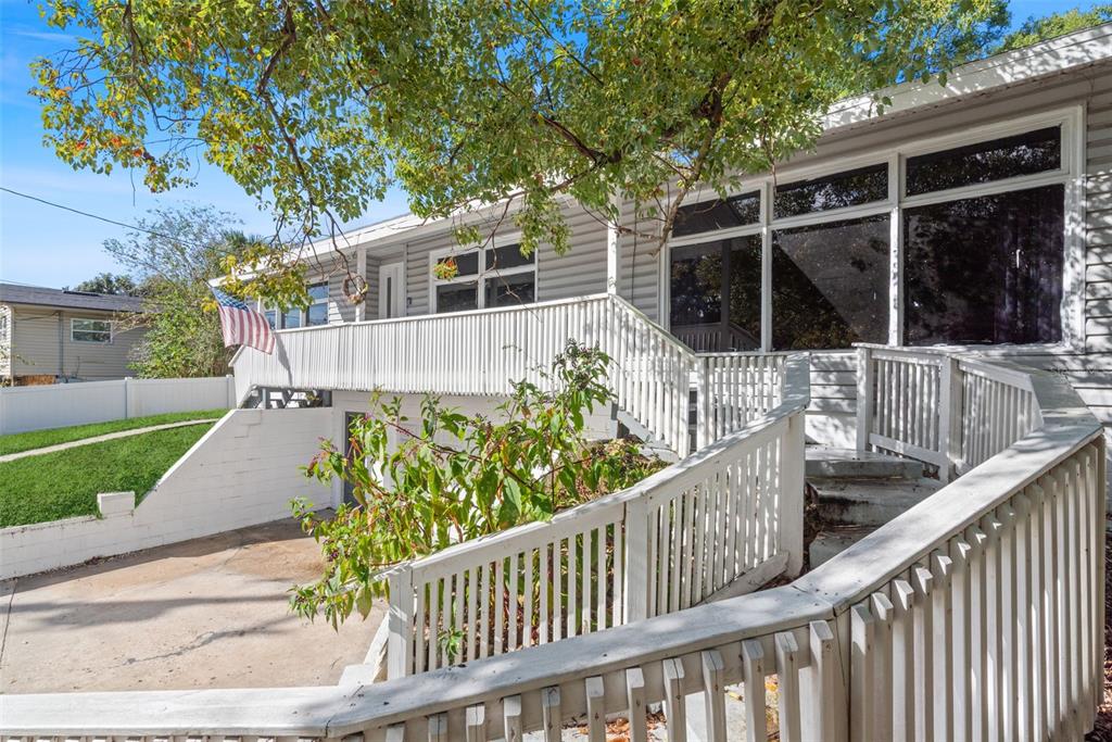 2508 Good Homes Road Orlando, FL 32818 - Photo 2 of 30 a view of a house with a small yard and wooden fence