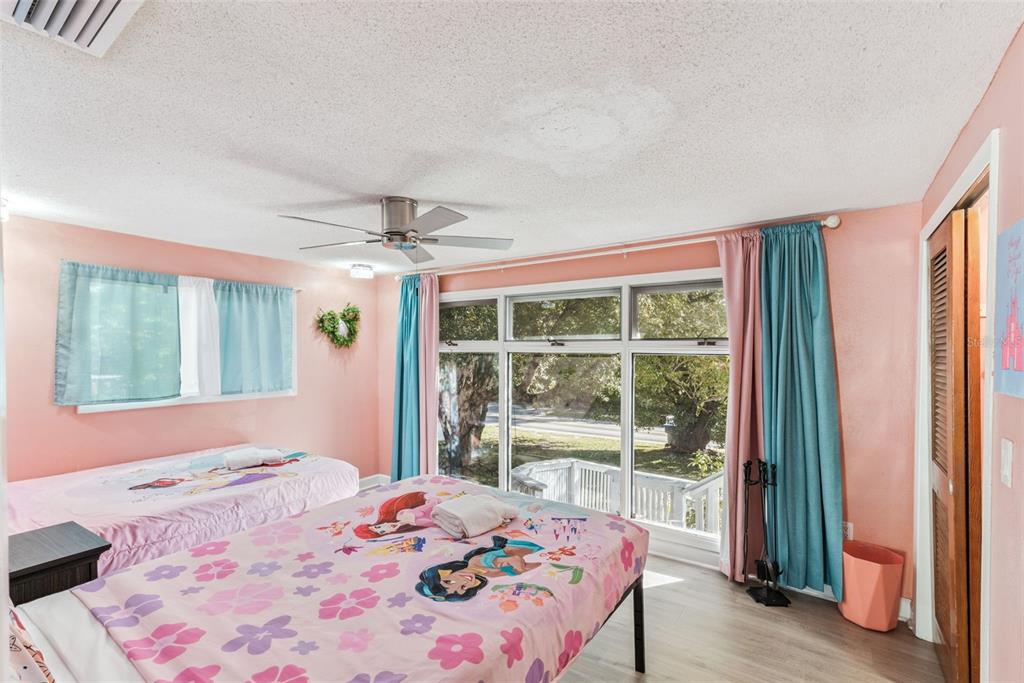 2508 Good Homes Road Orlando, FL 32818 - Photo 25 of 30 a bedroom with a bed and a large window