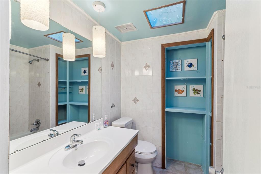 2508 Good Homes Road Orlando, FL 32818 - Photo 26 of 30 a bathroom with a sink and a mirror