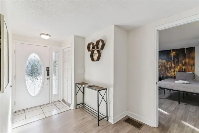 a view of an entryway with wooden floor