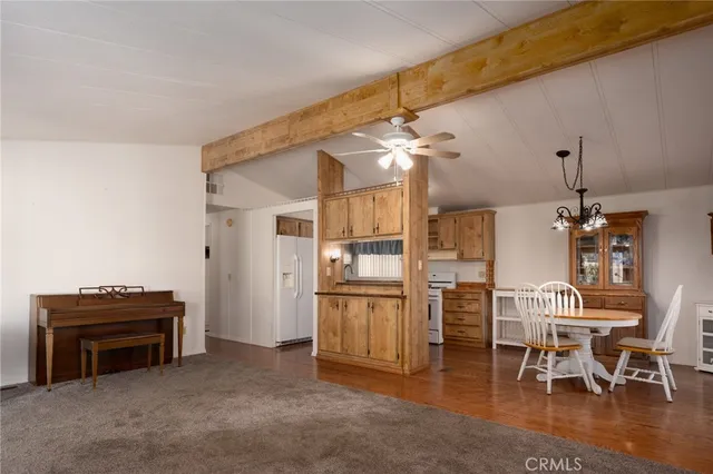 a view of kitchen with furniture and chandelier