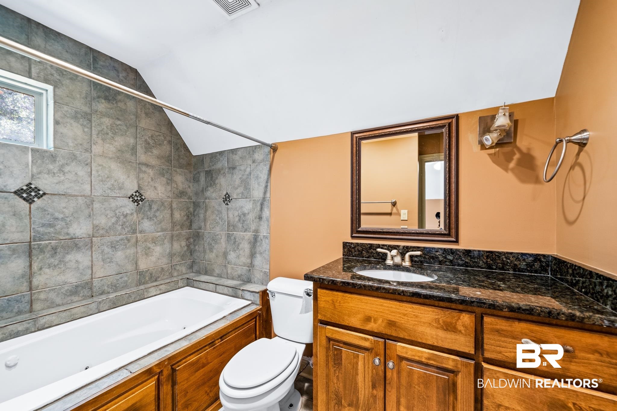 8321 Dixon Road Bay Minette, AL 36507 - Photo 46 of 79 Full bathroom with tiled shower / bath combo, vanity, vaulted ceiling, and toilet