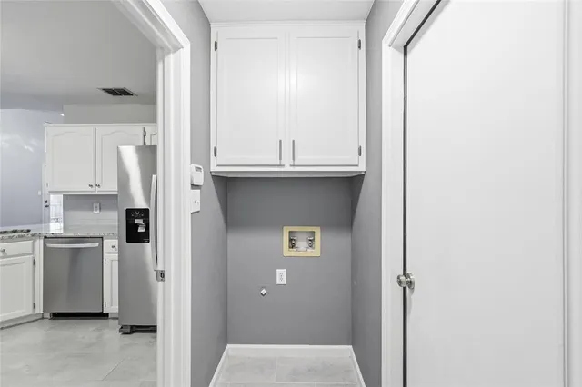 a view of a kitchen from the hallway