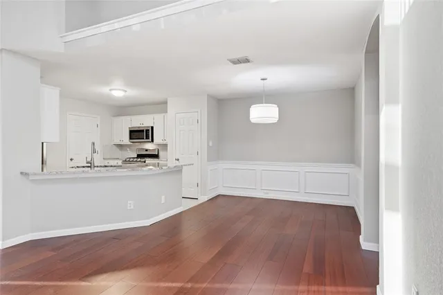 a view of kitchen with wooden floor