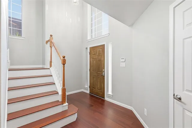 a view of an entryway with wooden floor