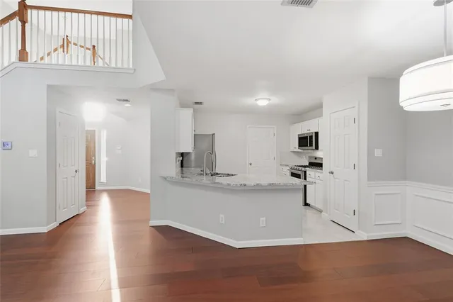 a view of kitchen with wooden floor