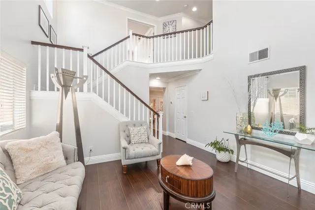 a living room with furniture and a rug