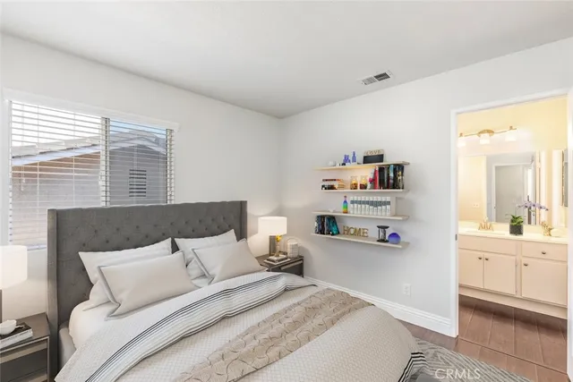 a bathroom with a sink vanity mirror and toilet