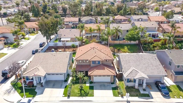 an aerial view of multiple houses with yard