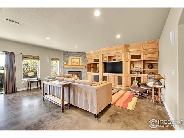 a kitchen with granite countertop a sink cabinets and stainless steel appliances