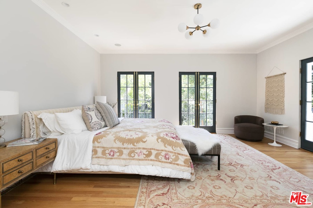 2529 North Commonwealth Avenue Los Angeles, CA 90027 - Photo 15 of 37 a bedroom with a bed and wooden floor